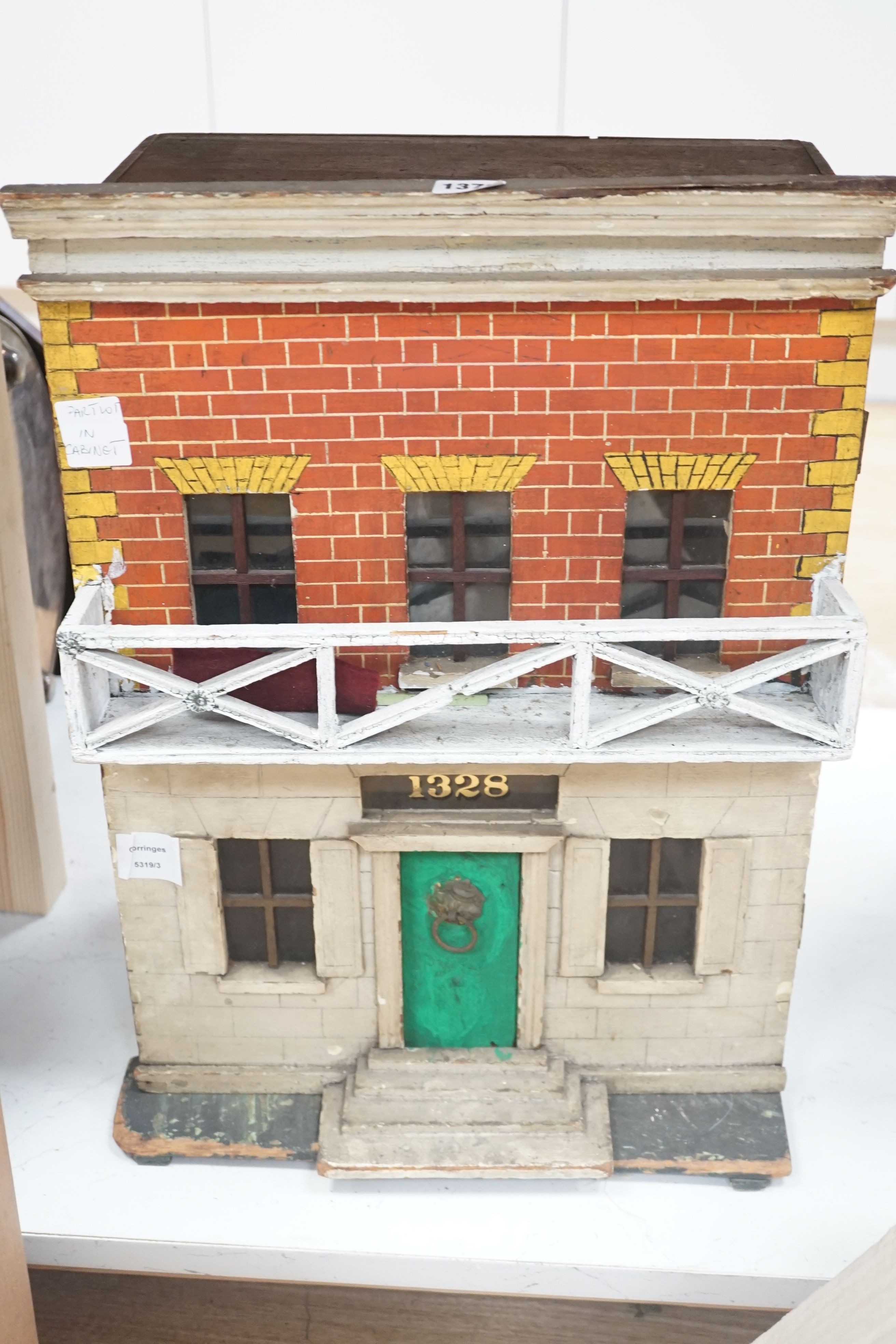 A Victorian doll's house and table accessories, height 56cm, depth 23cm excluding balcony and steps, width 39cm